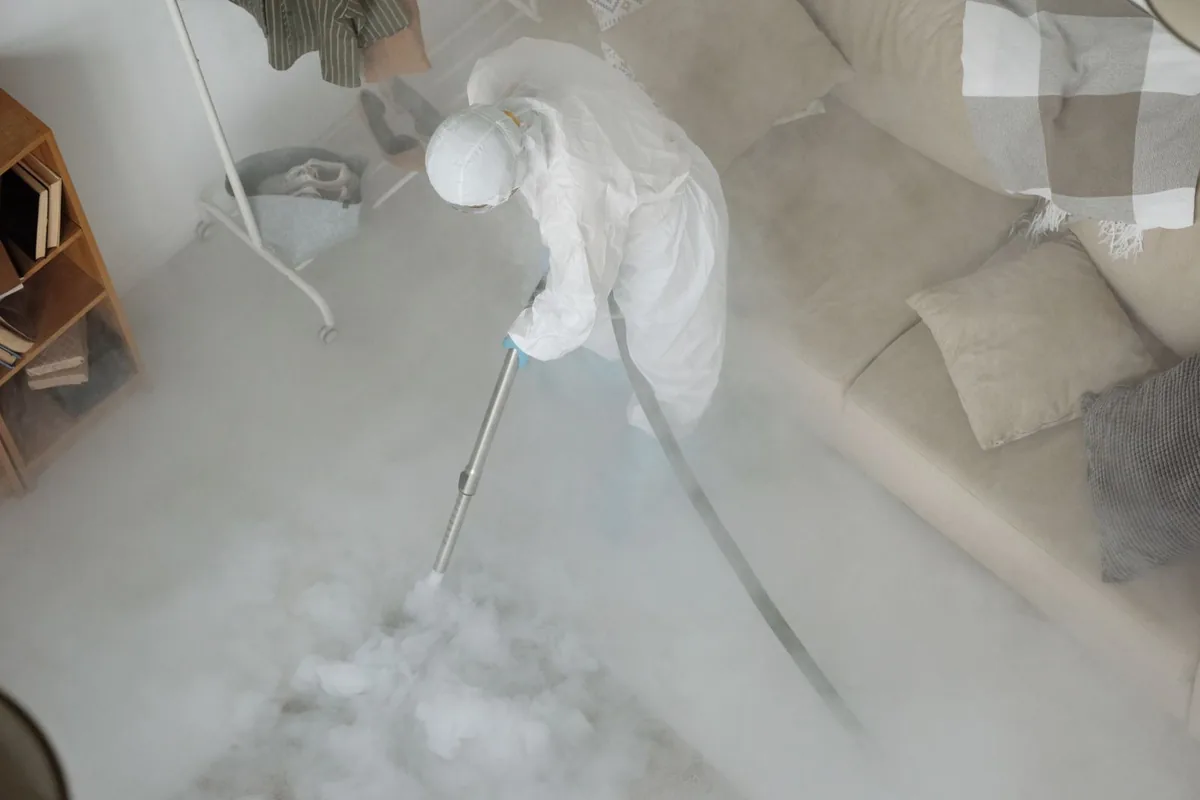 Biohazard cleanup technician in protective equipment, Old Kensington, Philadelphia, PA